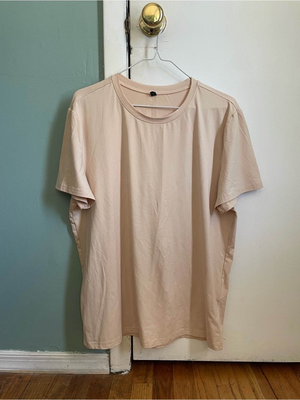 beige T-Shirt with graphic on back